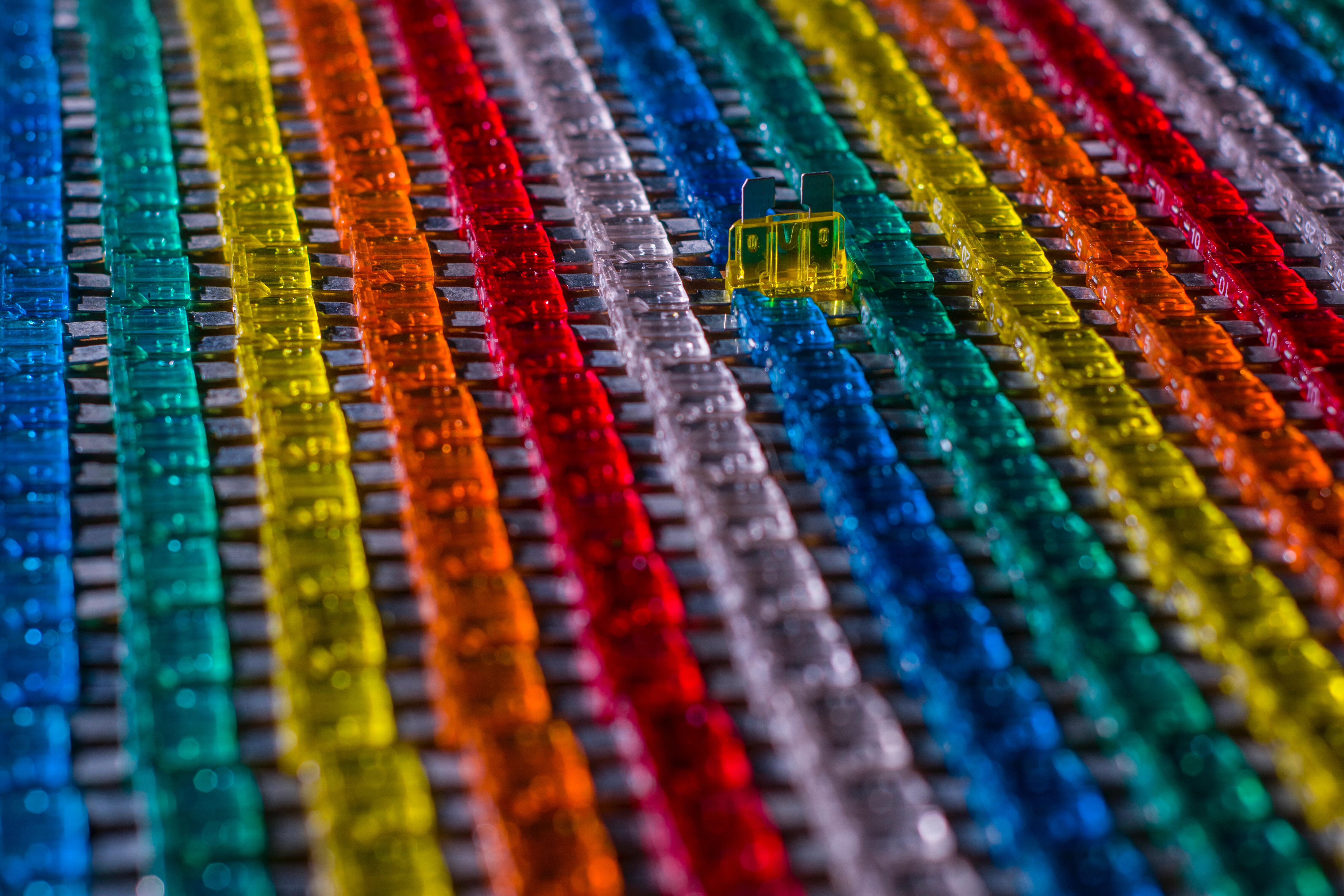 A collection of colourful blade fuses